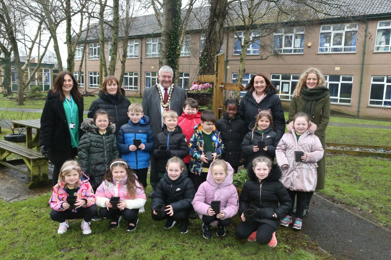 Ballykelly PTA Intergenerational Project. Standing from left: Maureen Duffy, Limavady GP Federation with Pear Mullan, classroom assistant, Mayor of Causeway Coast and Glens Councillor Ivor Wallace, Principal Alana Willis and Catherine Farrimond, Community Development Officer, joined by pupils from P3/4