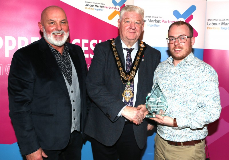 Mayor of Causeway Coast and Glens, Councillor Steven Callaghan alongside Labour Market Partnership Manager, Marc McGerty presenting Brandon Hughes with a Special Recognition Award.