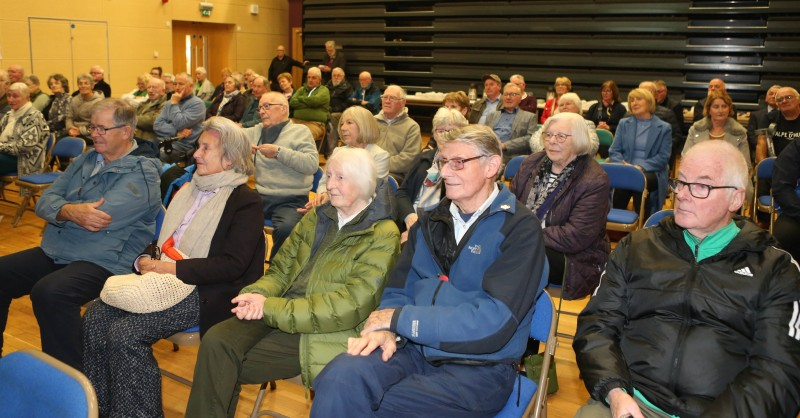 Visitors to the Nelson McGonagle Exhibition listening attentively to the speakers during the launch.