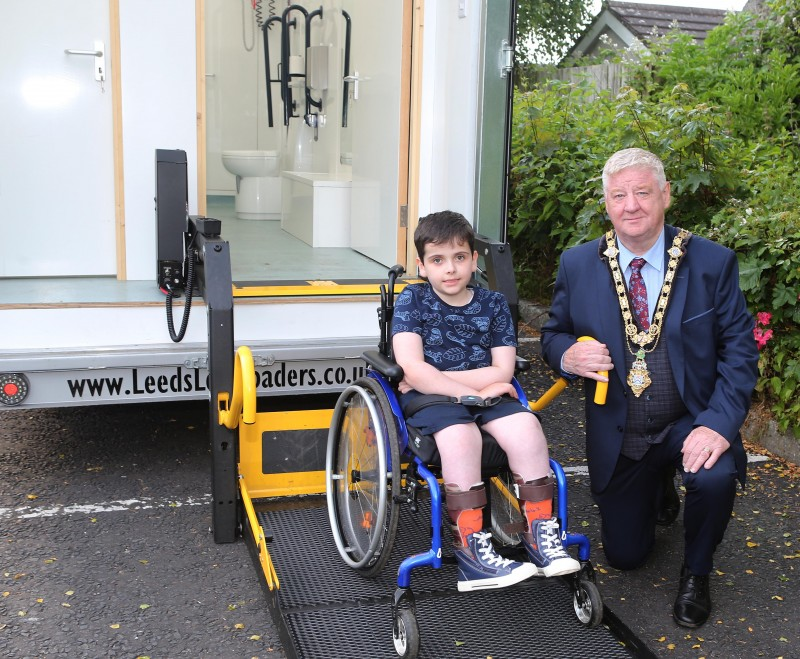 The Mayor of Causeway Coast and Glens Borough Council pictured alongside one of the children who attended Flowerfield's recent all inclusive family event.
