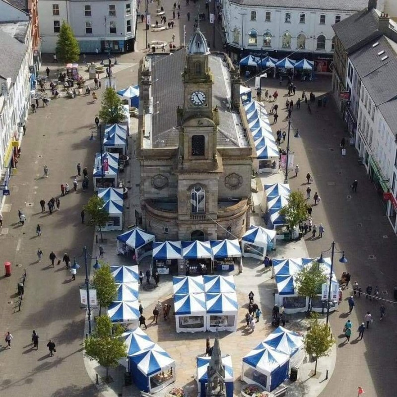 A drone shot of Coleraine's Diamond with market stalls surrounding it