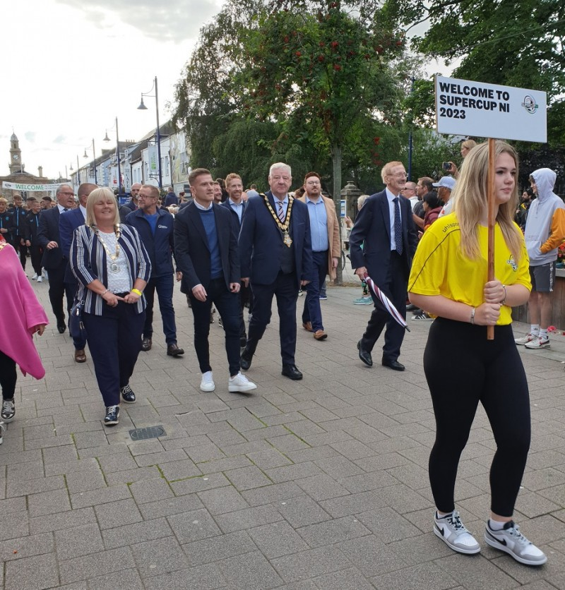 Mayor of Causeway Coast and Glens Borough Council, Councillor Steven Callaghan and Deputy Mayor of Causeway Coast and Glens Borough Council, Councillor Margaret Anne McKillop join the opening parade for this year’s Supercup NI as it makes its way through Coleraine town centre