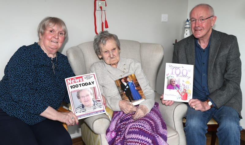 : Lily Patrick with her daughter Joan and son in law Leonard Quigg with her 100th birthday card from King Charles