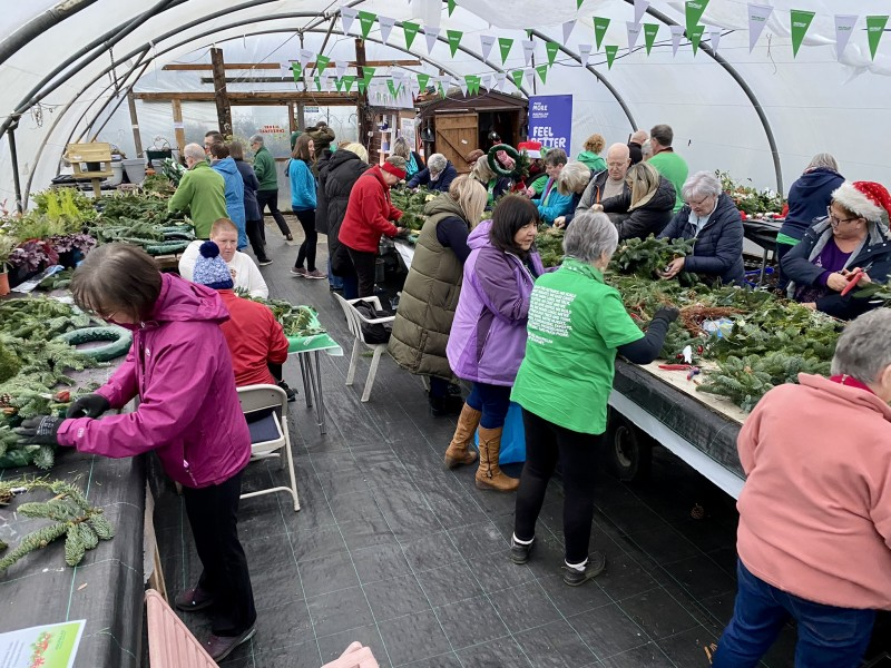 Move More participant’s and their families designing Christmas wreaths at Garvagh polytunnel.