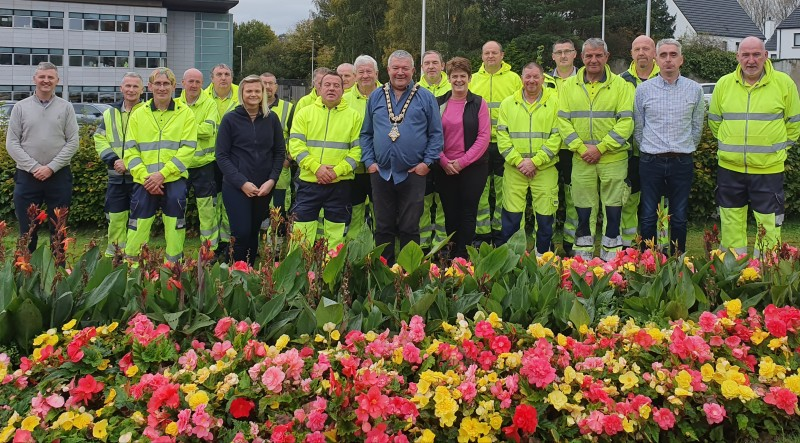 The Mayor of Causeway Coast and Glens Borough Council, Councillor Ivor Wallace, pictured with Parks staff at Cloonavin following the announcement of Coleraine’s success in the Ulster in Bloom competition.