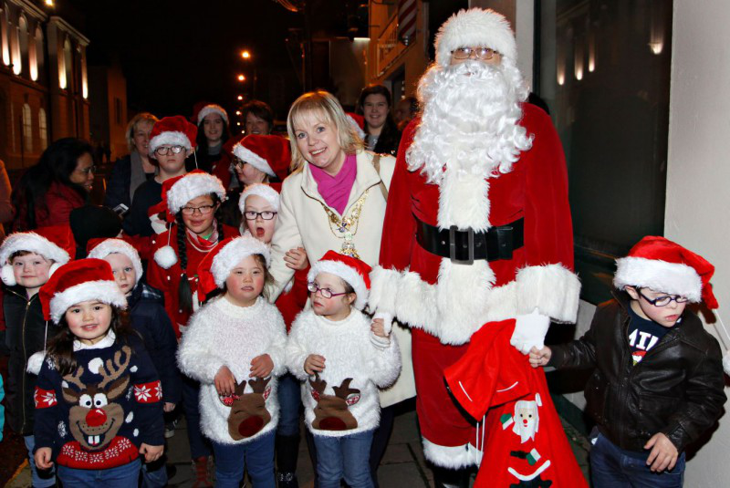 Mayor of Causeway Coast and Glens Borough Council, Councillor Michelle Knight-McQuillan and Santa with the children of the Causeway Down Syndrome Group at Ballymoney Christmas Lights Switch On.