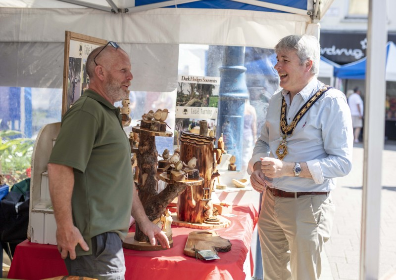 The Mayor of Causeway Coast and Glens Borough Council Councillor Richard Holmes chats with woodturner Gerard Gray from Taisie Turning at Causeway Speciality Market in Coleraine.