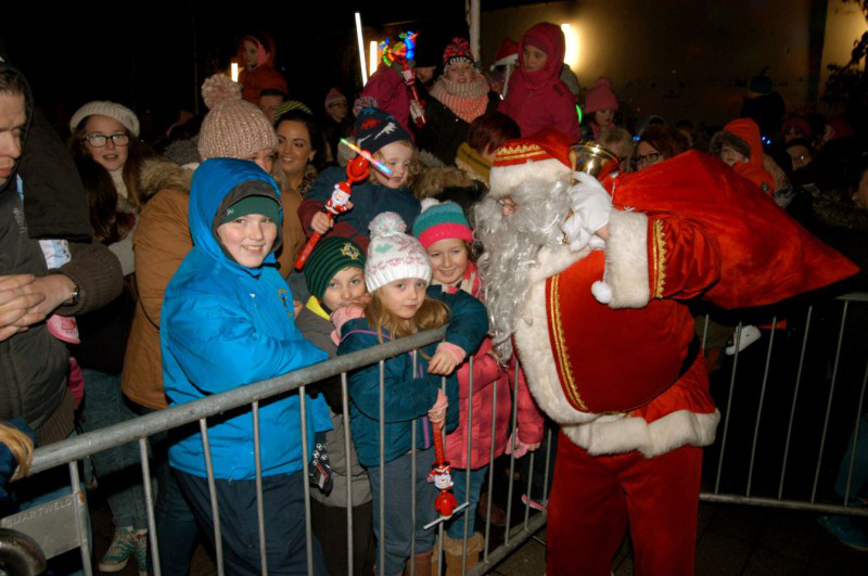 Pictured is Santa meeting families as he arrives.