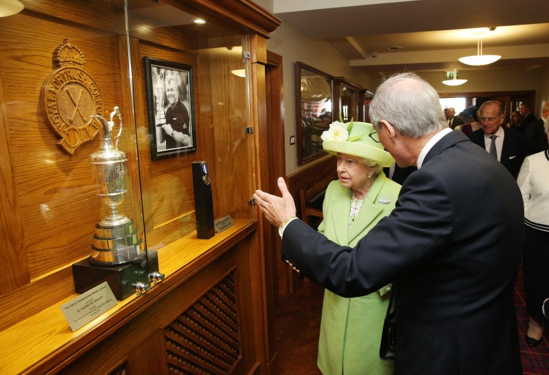 2016, The Queen is shown Darren Clarke’s medal from his win at The Open at Royal Portrush Golf Club.