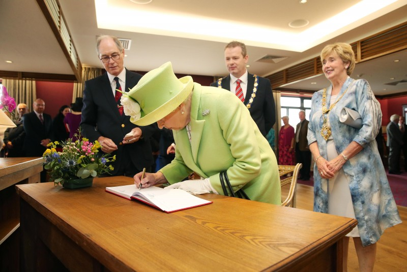 2016, Signing the visitor book at Royal Portrush Golf Club.