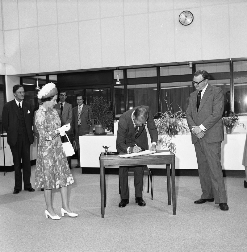 1977, The Queen and Prince Philip sign the visitor book at Ulster University, Coleraine.