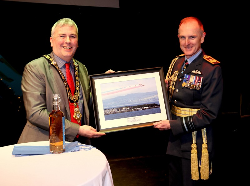 The Mayor presents Air Marshal Sir Gerry Mayhew with a framed photograph of the Red Arrows over Portrush.