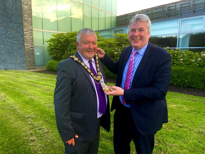 The new Mayor of Causeway Coast and Glens Borough Council Councillor Ivor Wallace receives his chain from outgoing Mayor, Councillor Richard Holmes, after the Annual Meeting on June 7th 2022.