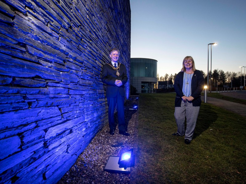 Mayor of Causeway Coast and Glens Borough Council Alderman Mark Fielding and Councillor Margaret Anne McKillop mark World Autism Awareness Day by shining blue lights on Cloonavin today (Friday 2nd April 2021) as part of an annual campaign to raise awareness about autistic spectrum disorders