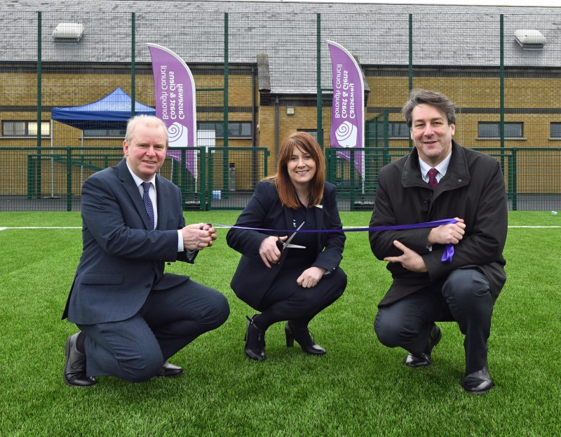 Cutting the ribbon to mark the official opening of Ballymoney's new 3G pitch are Councillor Tom McKeown from Causeway Coast and Glens Borough Council, Antoinette McKeown from Sport NI and Ian Snowden from Department for Communities.