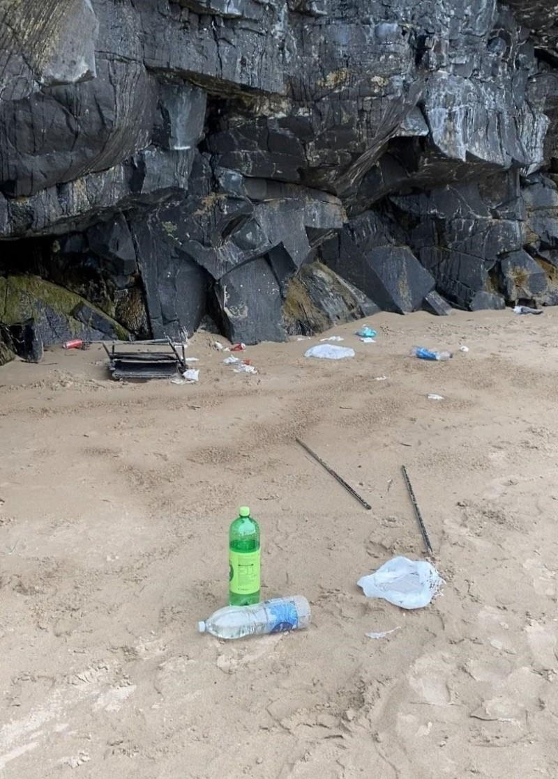 Plastic bottles and rubbish on the sand at Castlerock Beach.