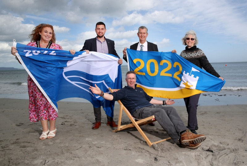 Pictured at the announcement of the Blue Flag and Seaside Awards are the Deputy Mayor of Causeway Coast and Glens Borough Council Councillor Ashleen Schenning, DAERA Minister, Edwin Poots, Harbourmaster John Morton, Dr Sue Christie, Chair, Keep Northern Ireland Beautiful and Coast and Countryside Officer Michael McConaghy (seated).