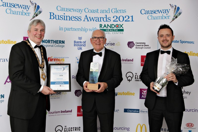 The Mayor of Causeway Coast and Glens Borough Council Councillor Richard Holmes pictured with  James Smyth of Smyth Steel, the recipient of the Lifetime Achievement Award at Causeway Coast and Glens Business Awards, along with Mark Boyd from Smyth Steel.