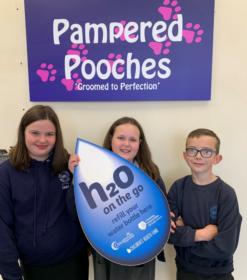 Pupils from Carhill Integrated Primary School pictured at Pampered Pooches in Garvagh which has signed up to Causeway Coast and Glens Borough Council’s H20 On The Go scheme.