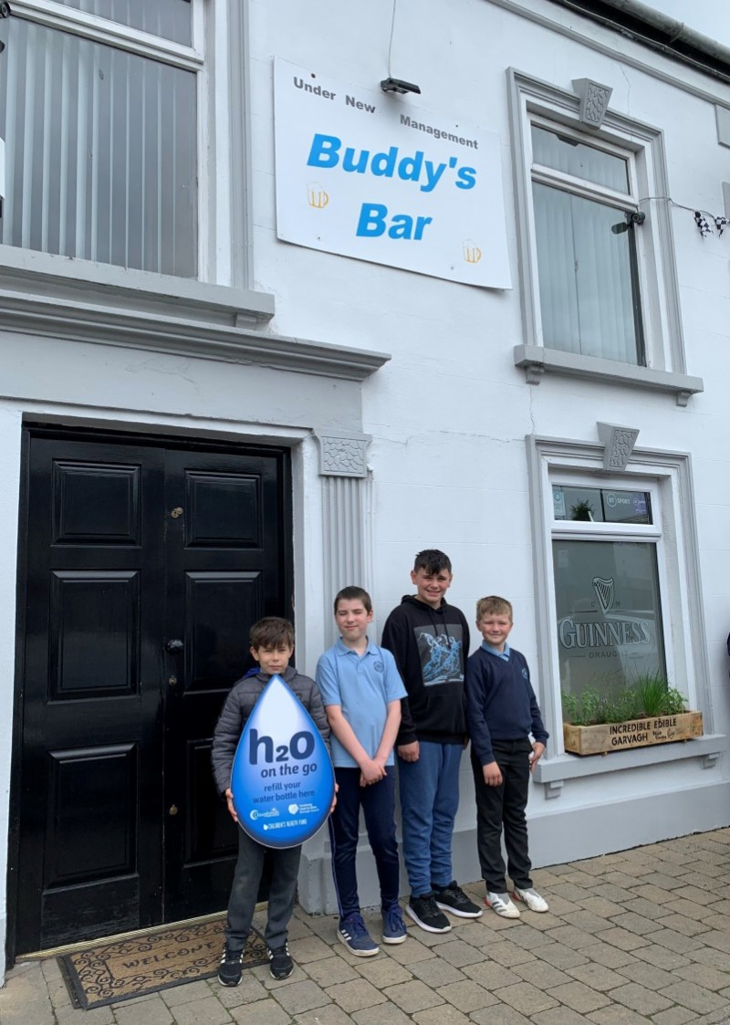 Pupils pictured outside Buddy’s Bar in Garvagh which has signed up to Causeway Coast and Glens Borough Council’s H20 On The Go scheme.