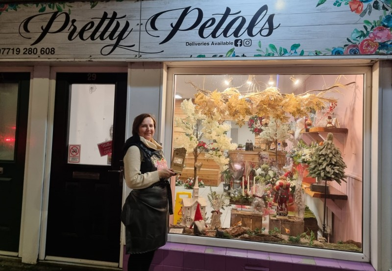 Pretty Petals, Kilrea won the 2022 Christmas Window competition, pictured is Tracy Dillon who was delighted that their very on-trend Christmas display was recognised by the judges.