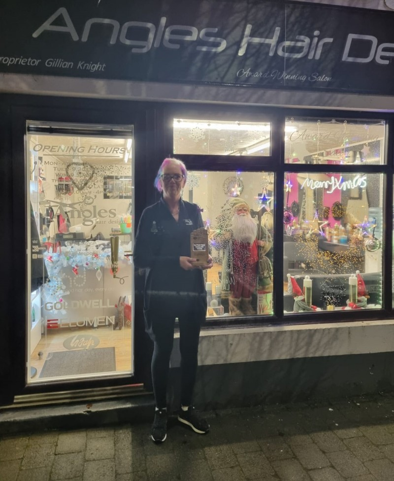 Gillian Knight pictured with the winning trophy for Garvagh, Angle Hair Designs impressed the judges with their traditional Father Christmas display.