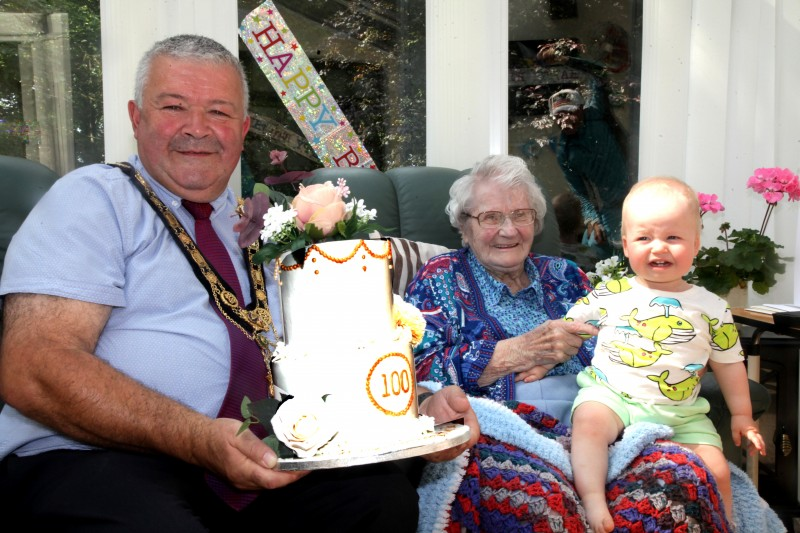 The Mayor of Causeway Coast and Glens Borough Council Councillor Ivor Wallace pictured with Ida Love during his visit to mark her 100th birthday, along with Ida’s great-great-great nephew Matt Gray.