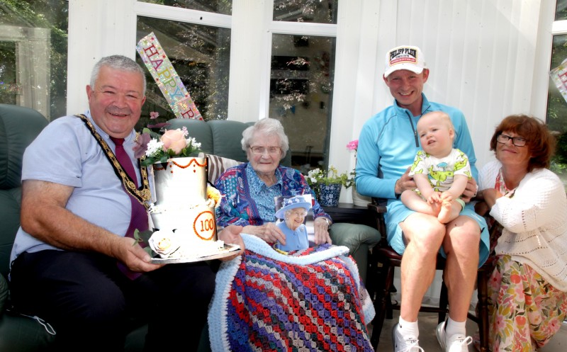 The Mayor of Causeway Coast and Glens Borough Council pictured with Ida Love during his visit to mark her 100th birthday, along with Ida’s great-great-great nephew Matt Gray, her great-great nephew William and great niece Ann Gray.
