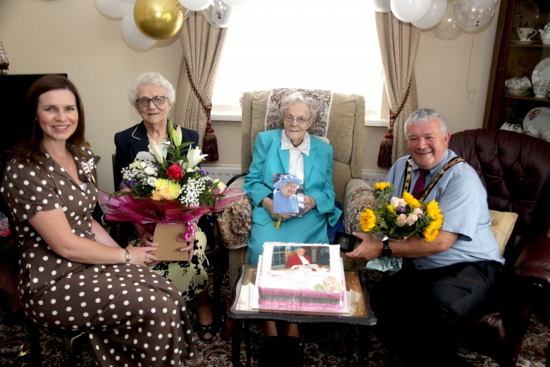 Emma Cairns from Limavady pictured with her sister Margaret Kearney, the Mayor of Causeway Coast and Glens Borough Council, Councillor Ivor Wallace, and the Deputy Lieutenant of County Londonderry, Leona Kane during her recent 100th birthday celebrations.