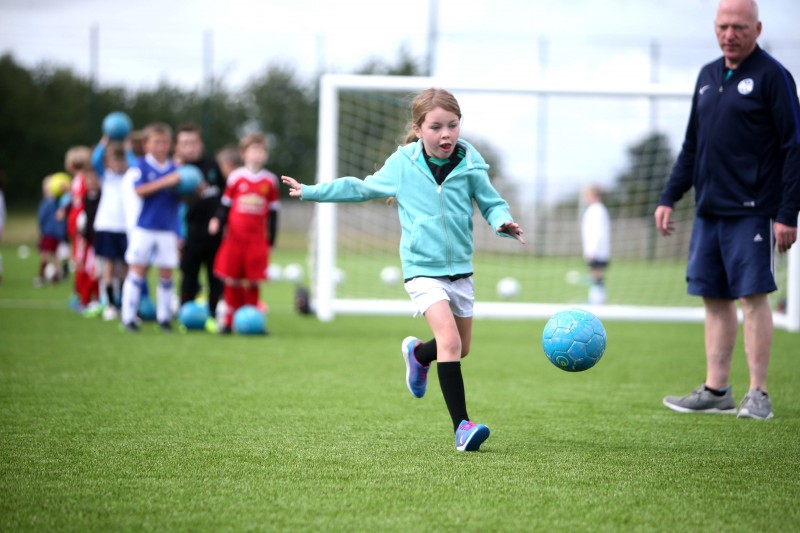 Keeping her eye firmly on the ball during the Soccer Fun Week held on the new 3G pitch in Ballymoney.