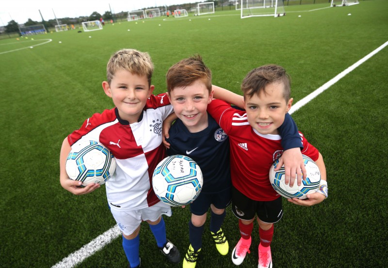 Smiling for the camera during the recent Soccer Fun Week held on the new 3G pitch in Ballymoney.