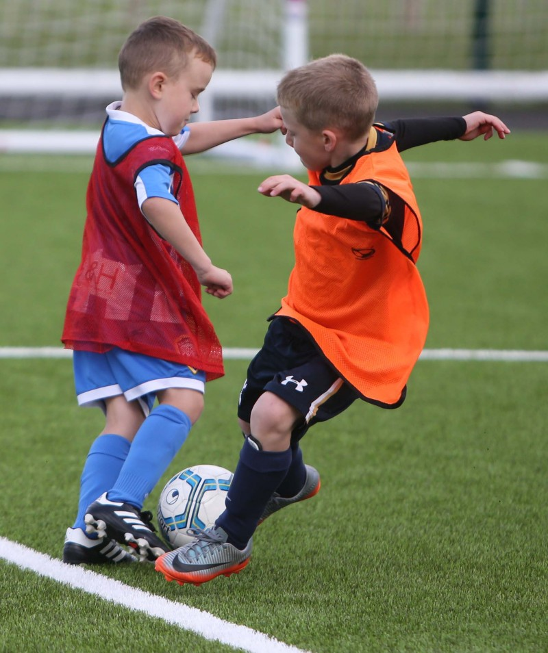 An action shot taken during the recent Soccer Fun Week held on the new 3G pitch in Ballymoney.