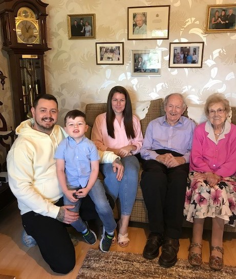 Alex and Agnes McElreavey who celebrated their 70th wedding anniversary on September 10th 2022 pictured with their grand-daughter Laura, her husband Trevor and great-grandson Oliver.