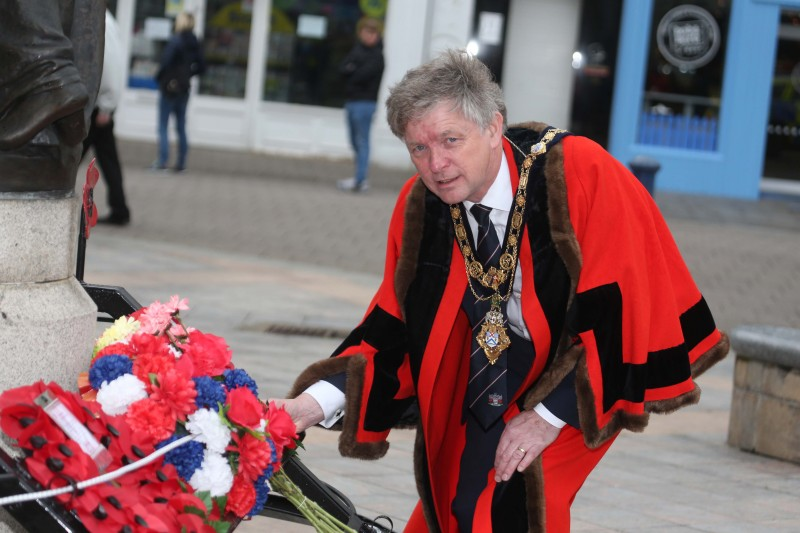 The Mayor of Causeway Coast and Glens Borough Council Alderman Mark Fielding lays a wreath at the War Memorial in Coleraine during a short service on Monday 22nd June 2020, the beginning of Armed Forces Wee
