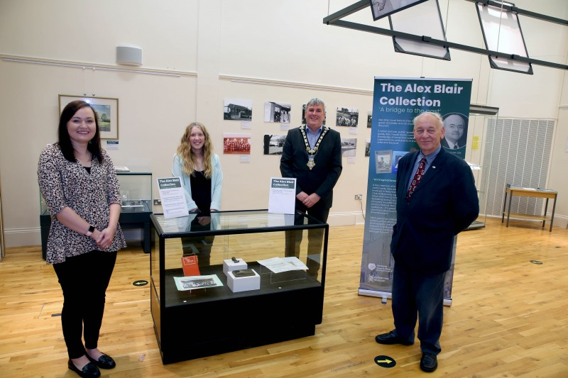 Museum Assistant Rachel Archibald, Museum Officer Jamie Austin and the Mayor of Causeway Coast and Glens Borough Council, Councillor Richard Holmes, pictured at the exhibition showcasing the personal collection of Alex Blair with Mac Pollock, Chairman of Ballymoney Drama Festival