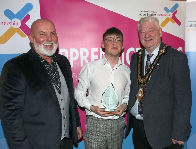 Mayor of Causeway Coast and Glens, Councillor Steven Callaghan alongside Labour Market Partnership Manager, Marc McGerty presenting Shea McIlwee with a Special Recognition Award.