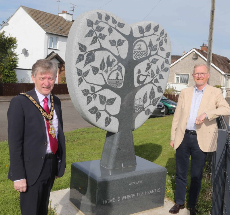 The Mayor of Causeway Coast and Glens Borough Council Alderman Mark Fielding pictured with Rev Jim McCaughan at the unveiling of the “Home Is Where The Heart Is” sculpture in Articlave.