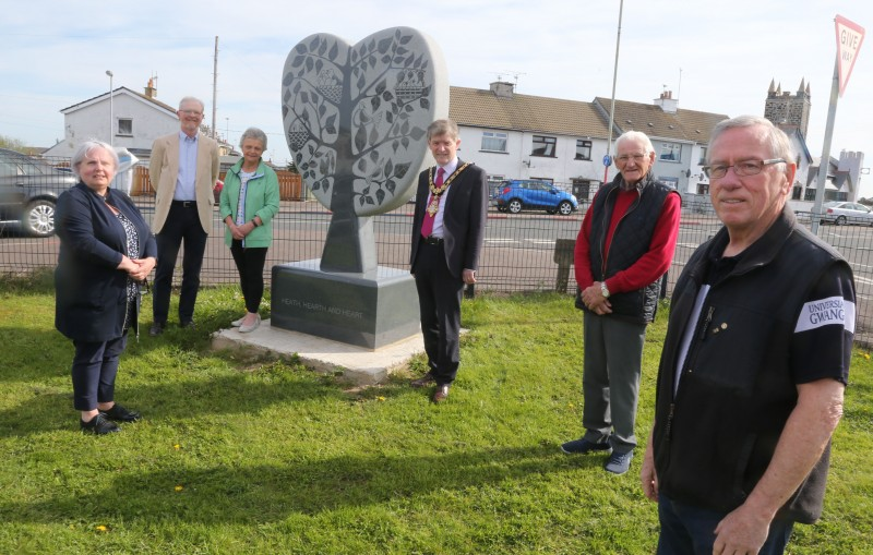 The Mayor of Causeway Coast and Glens Borough Council Alderman Mark Fielding pictured at the unveiling of the village’s new sculpture with members of the Articlave community who were involved in the initiative