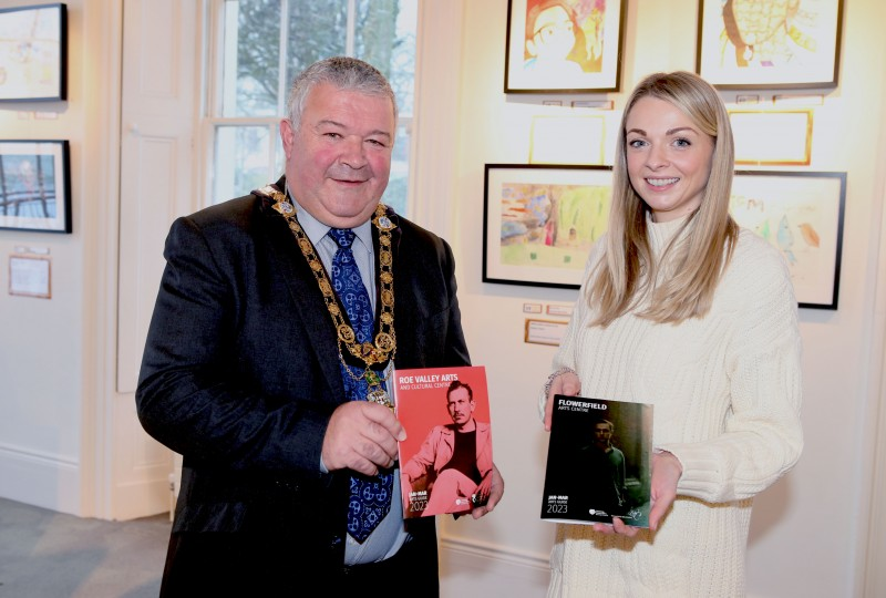 The Mayor of Causeway Coast and Glens Borough Council, Councillor Ivor Wallace, helps to launch the new Arts Guides for Flowerfield Arts Centre and Roe Valley Arts and Cultural Centre, along with Amy Donaghey, Arts Marketing and Engagement Officer.