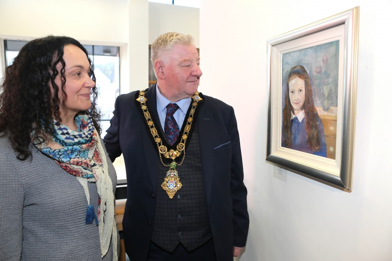 The Mayor of Causeway Coast and Glens, Councillor Steven Callaghan admires one of the pieces of art on display at Limavady Art Group’s Winter Exhibition at Roe Valley Arts and Cultural Centre.