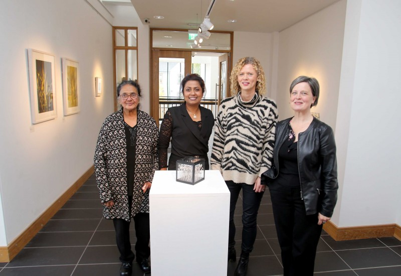 Artist Anushiya Sundaralingam pictured with guests at the opening of her Marankal exhibition at Roe Valley Arts and Cultural Centre.