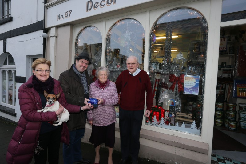Linda McKeown, alongside Margaret and James Craig from Craig’s Décor Centre, receive their prize for coming third in the Christmas Window Competition from Causeway Coast and Glens Borough Council Officer Shaun Kennedy.