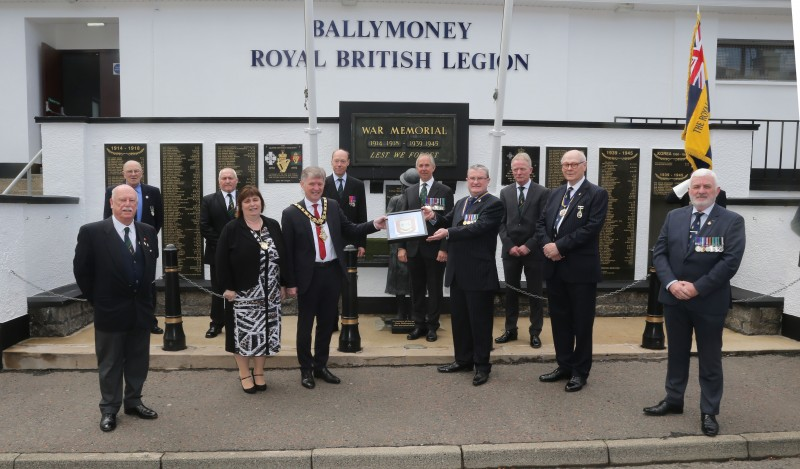 Members of Ballymoney Royal British Legion receive a framed Coat of Arms from the Mayor of Causeway Coast and Glens Borough Council Alderman Mark Fielding and Mayoress Mrs Phyliss Fielding in recognition of its receipt of the Queen’s Award for Voluntary Service.