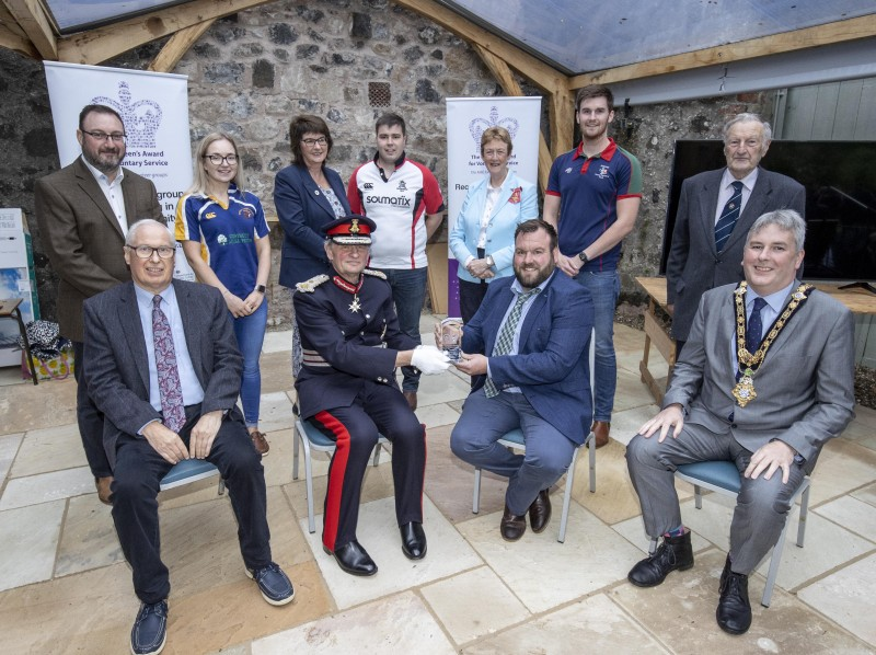 Pictured at a special event to mark the presentation of the Queen’s Award for Voluntary Service (QAVS) to North Antrim Agricultural Association are, back row, left to right, Robert Calvin, Rachel Smith, Sandra Adair MBE, James Kirkpatrick, Councillor Joan Baird OBE, Ryan Gamble, Joe Patton CBE. Front row, left to right, James Morrison, Lord Lieutenant for County Antrim Mr David McCorkell, Robert Shannon and the Mayor of Causeway Coast and Glens Borough Council Councillor Richard Holmes.