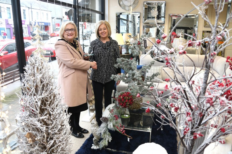 Janias Thom from Heart and Home, winner of the Christmas window competition in Ballymoney receives her award from the Mayor of Causeway Coast and Glens Borough Council Councillor Brenda Chivers.