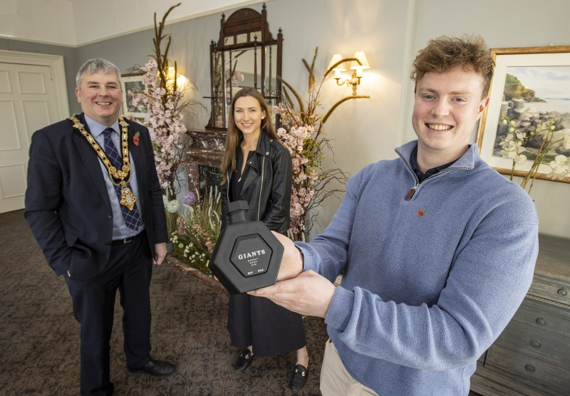 The Mayor of Causeway Coast and Glens Borough Council Councillor Richard Holmes pictured with James Richardson and Martha Gabe, the entrepreneurs behind the Basalt Distillery.