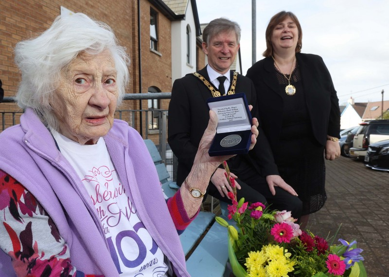 Bertha Fearson, who celebrated her 100th birthday on 11th February 2021, displays her commemorative centenary coin received from the Mayor of Causeway Coast and Glens Borough Council Alderman Mark Fielding and Mayoress Mrs Phyllis Fielding.