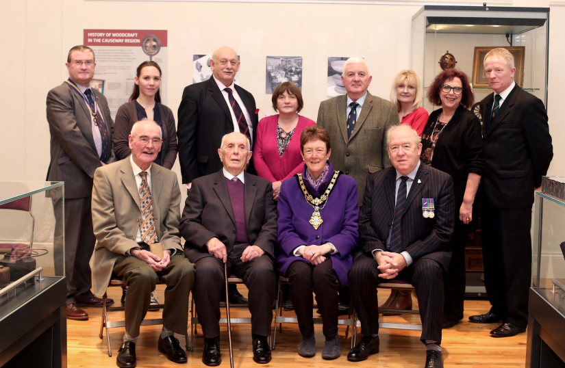 Edwin RL Chambers’ son Laurence and grandson Steven pictured with Ernest Crawford, his nephew Garnet Bustard (back row, third right) the Mayor of Causeway Coast and Glens Borough Council, Councillor Joan Baird OBE, staff from Causeway Coast and Glens Borough Council Museum Services and representatives of Ballymoney RBL in Ballymoney Museum.