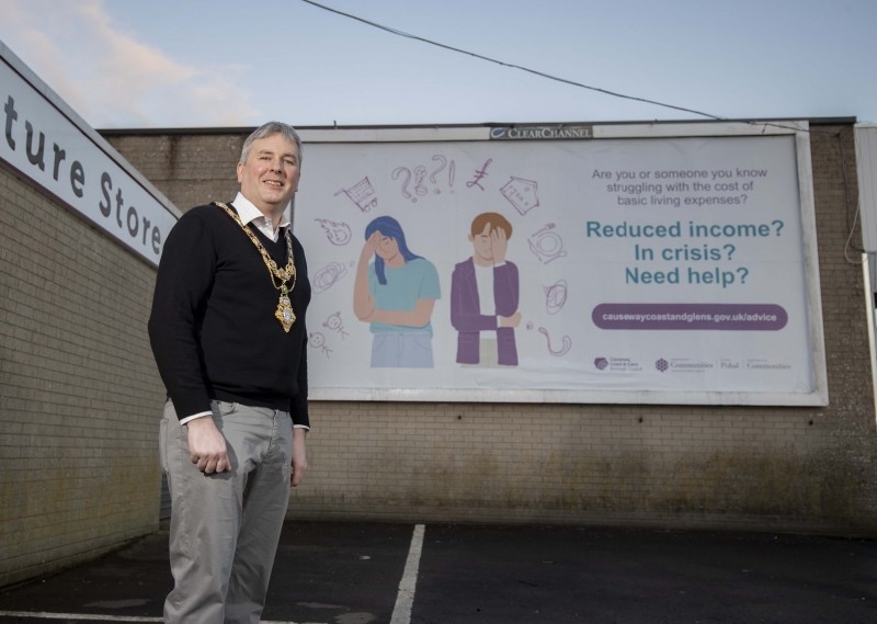 The Mayor of Causeway Coast and Glens Borough Council Councillor Richard Holmes pictured at the site of one of the Where To Turn campaign billboards in Ballymoney.
