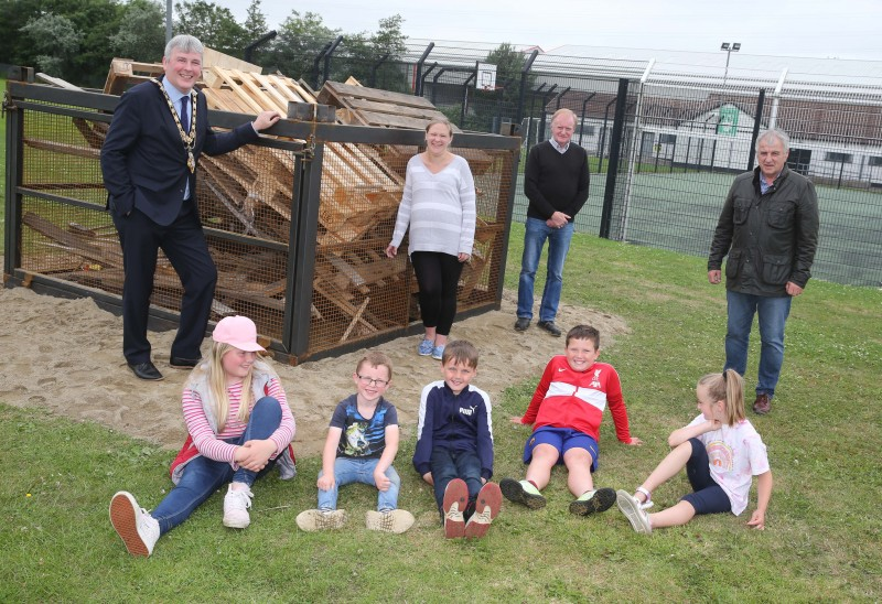 Mayor of Causeway Coast and Glens Borough Council, Richard Holmes with Cllr Watton Maurice Bradley MLA and Cassandra Hanna with local children at the Windy Hall beacon.